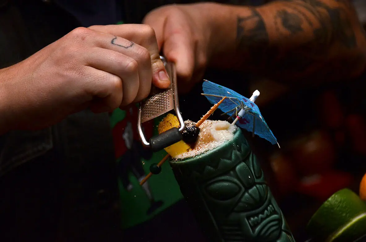 Painkiller in a tiki mug with fresh-grated nutmeg